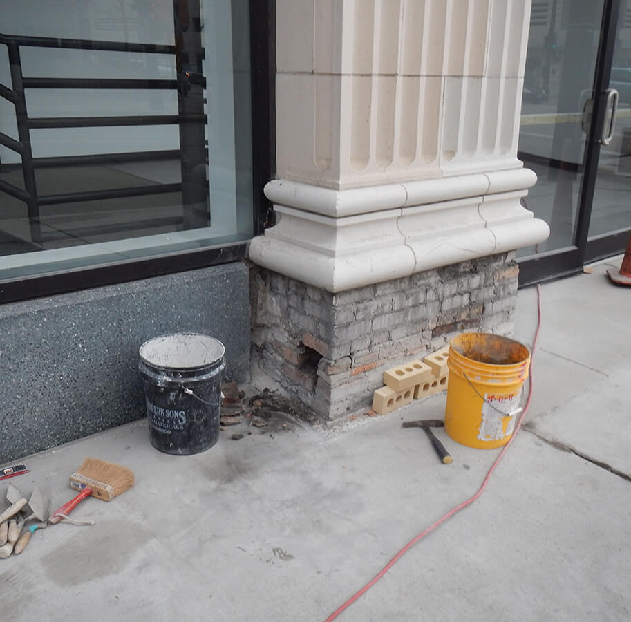 Stone facade column repair work in Milwaukee